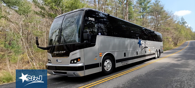 Image: C&J silver motor coach on the road